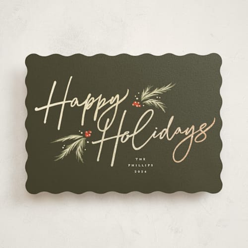 This is a pine foil pressed holiday cards with foil pressed by Robert and Stella called holiday script printing on signature in standard