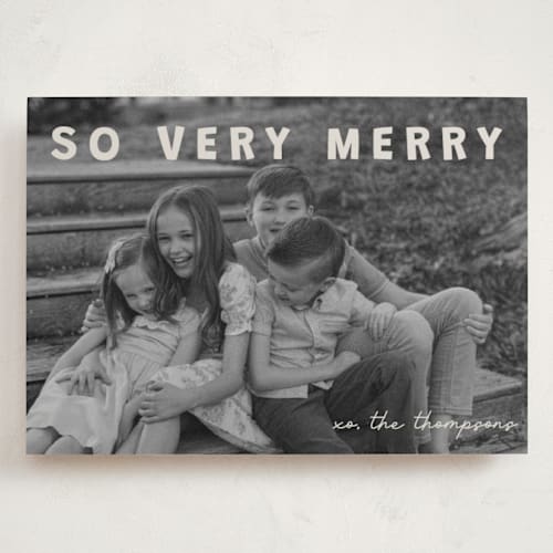 This is a cream holiday photo cards with standard by Jenny Millington called merry greeting printing on recycled smooth signature in grand