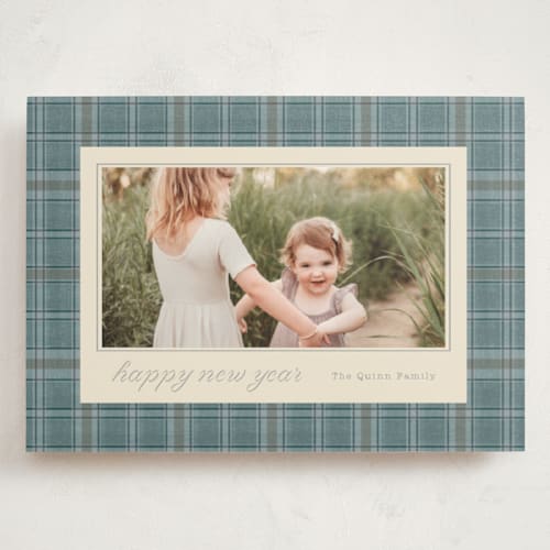 This is a powder blue holiday photo cards with standard by Baumbirdy called traditional plaid printing on signature in grand