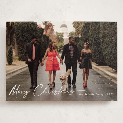 This is a ivory holiday photo cards with standard by Chris Griffith called holiday glee printing on signature in grand