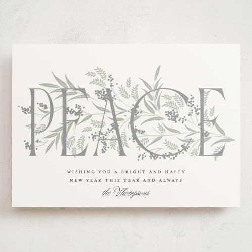 This is a snow holiday photo cards with standard by Robert and Stella called entwined peace printing on signature in grand