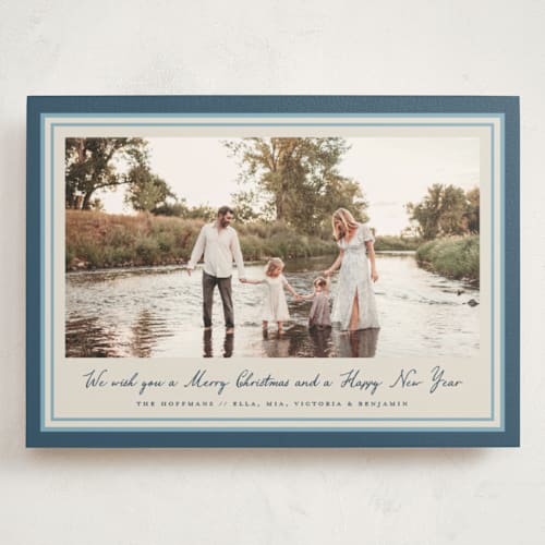 This is a blue spruce holiday photo cards with standard by Petra Kern called oasis printing on signature in grand