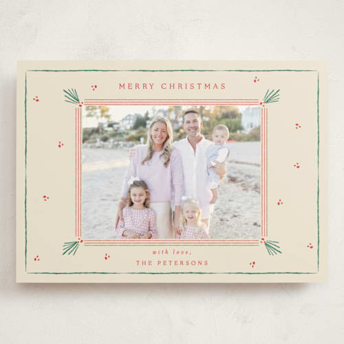 This is a holly holiday photo cards with standard by Sarah Rosenthal called holly tidings printing on signature in grand