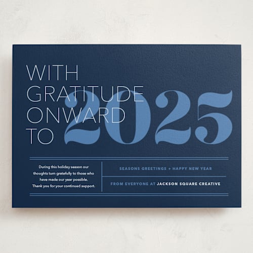 This is a blue night holiday photo cards with standard by Annie Clark called the grateful type printing on signature in grand