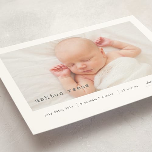 This is a soft grey birth announcement postcards with standard by Sara Hicks Malone called on display printing on signature in postcard