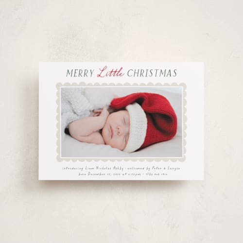 This is a holly babys first christmas with standard by Hooray Creative called merry scallop printing on recycled smooth signature in petite