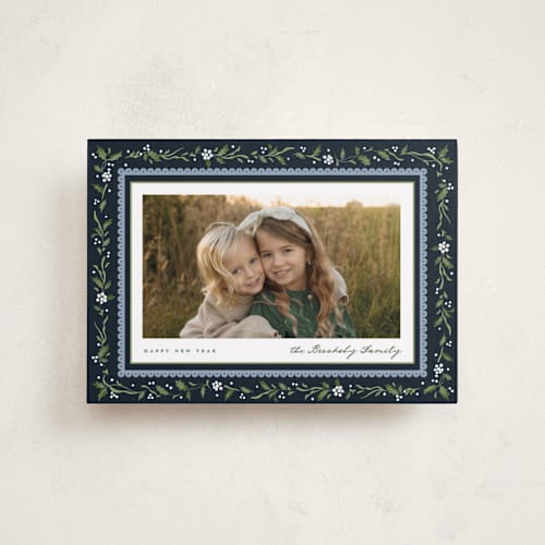 This is a deep blue petite holiday cards with standard by Erin L. Wilson called hollywick printing on recycled smooth signature in petite