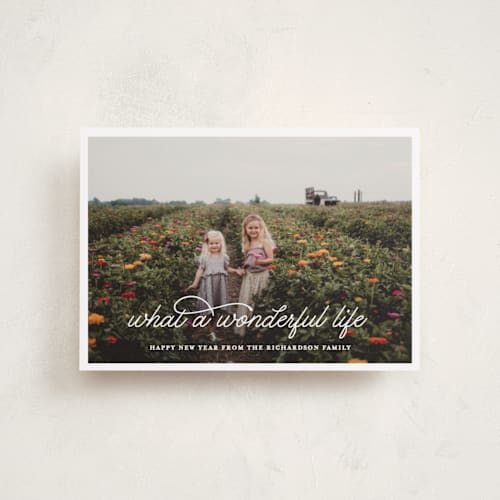 This is a snowflake petite holiday cards with standard by Leah Ragain called what a wonderful life printing on recycled smooth signature in petite