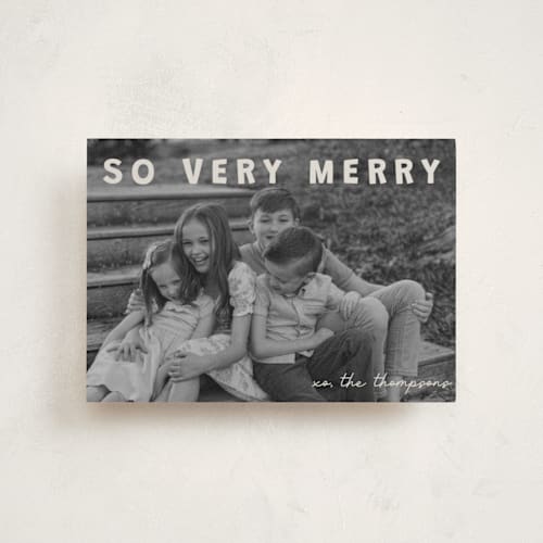 This is a cream petite holiday cards with standard by Jenny Millington called merry greeting printing on recycled smooth signature in petite