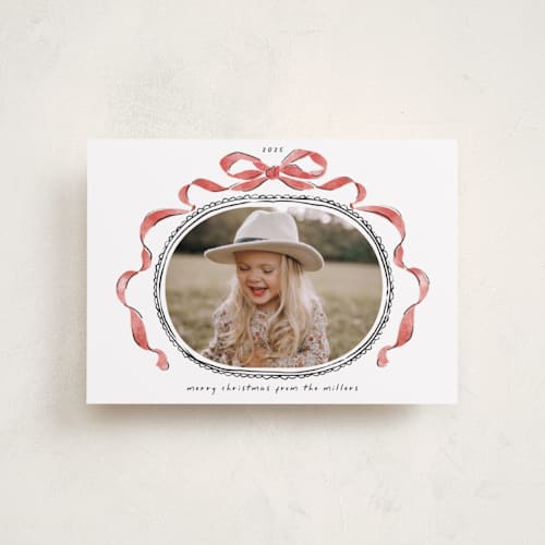 This is a pomegranate petite holiday cards with standard by Susan Zinader called whimsical bow printing on recycled smooth signature in petite