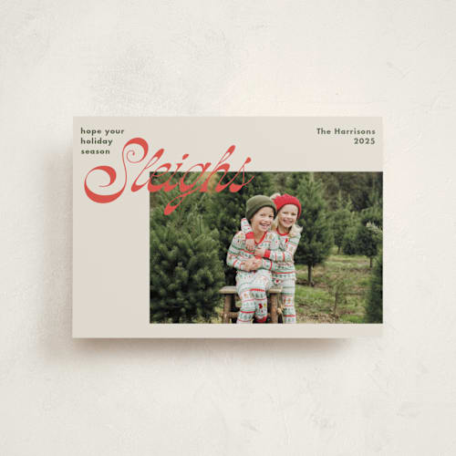 This is a red bow petite holiday cards with standard by Megan Davis called sleighs printing on recycled smooth signature in petite