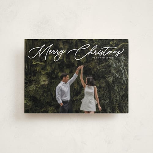 This is a snowfall petite holiday cards with standard by Melanie Kosuge called merry monoline printing on recycled smooth signature in petite