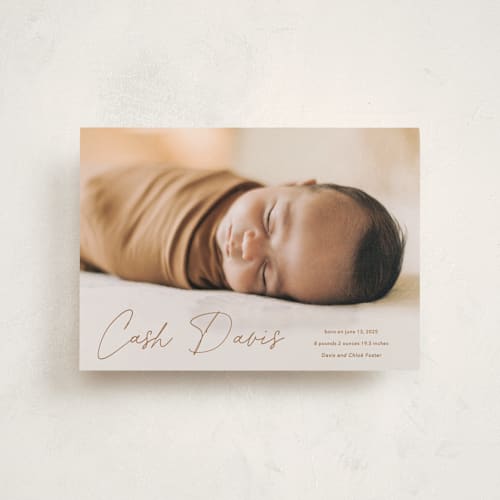 This is a rust birth announcement postcards with standard by Stacey Meacham called swaddle printing on signature in postcard