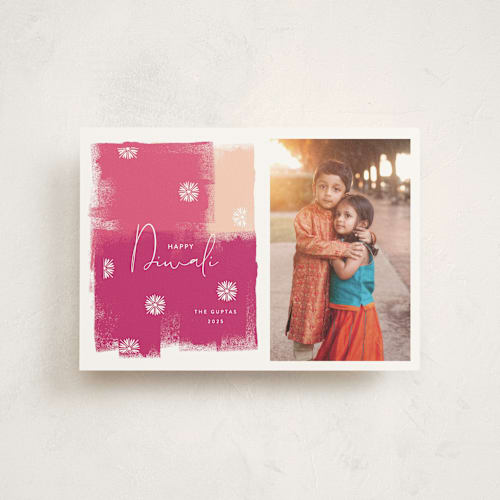 This is a fuchsia diwali cards with standard by Nazia Hyder called diwali splash printing on signature in postcard