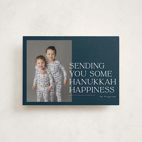 This is a navy hanukkah cards with standard by Jackie Crawford called sending holiday happiness printing on signature in postcard
