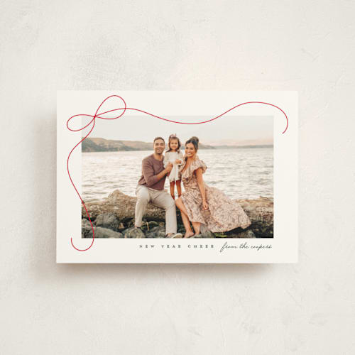 This is a snow christmas postcards with standard by Lauren Chism called cascading bow printing on signature in postcard