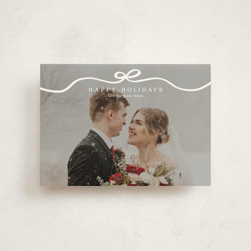 This is a snow christmas postcards with standard by Kaydi Bishop called bow tied printing on signature in postcard