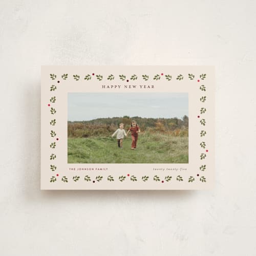 This is a vintage holiday christmas postcards with standard by Poised Avenue called framed by holly printing on signature in postcard