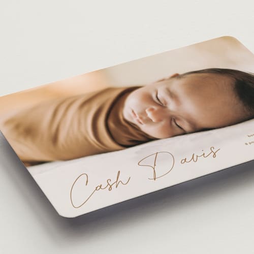 This is a rust birth announcement magnets with standard by Stacey Meacham called swaddle printing on magnet paper in magnet