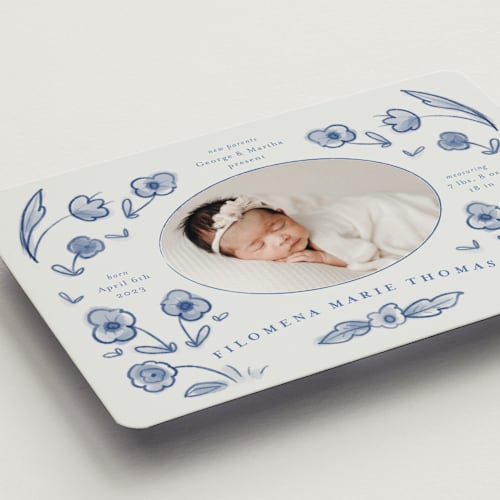 This is a delft blue birth announcement magnets with standard by Ani Somi called painted flowers printing on magnet paper in magnet