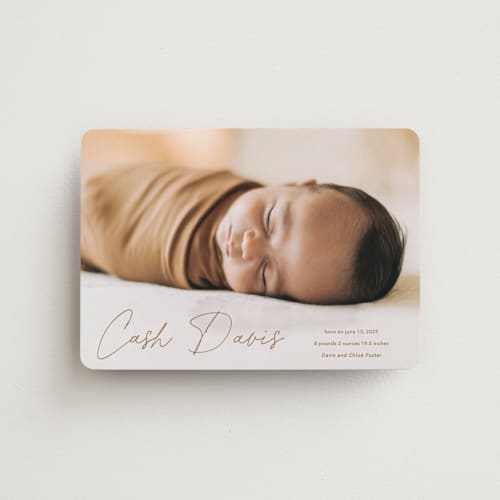 This is a rust birth announcement magnets with standard by Stacey Meacham called swaddle printing on magnet paper in magnet