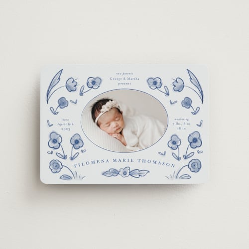This is a delft blue birth announcement magnets with standard by Ani Somi called painted flowers printing on magnet paper in magnet
