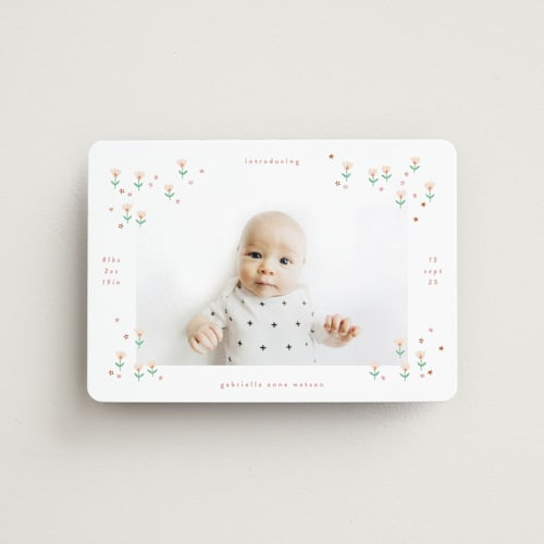 This is a spring birth announcement magnets with standard by Phrosné Barwood called tiny blooms printing on magnet paper in magnet