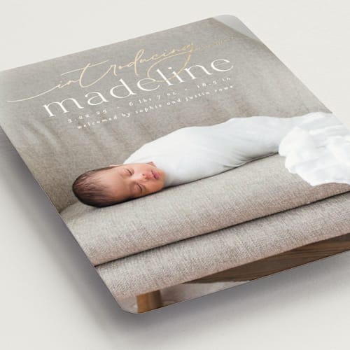 This is a parchment birth announcement magnets with foil pressed by Everett Paper Goods called mist printing on magnet paper in magnet