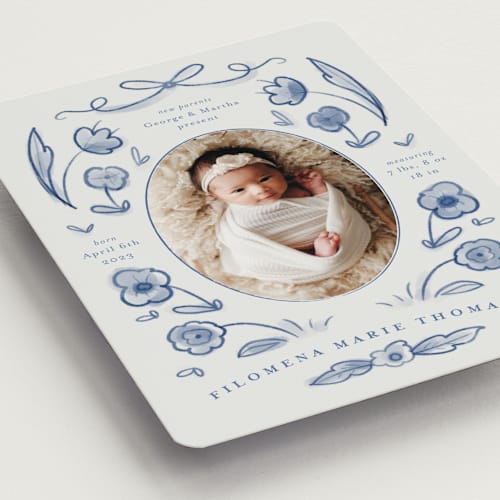 This is a delft blue birth announcement magnets with standard by Ani Somi called painted flowers printing on magnet paper in magnet