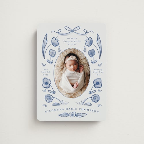 This is a delft blue birth announcement magnets with standard by Ani Somi called painted flowers printing on magnet paper in magnet