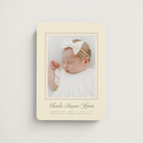 This is a creme birth announcement magnets with standard by mo kelley called classical border printing on magnet paper in magnet