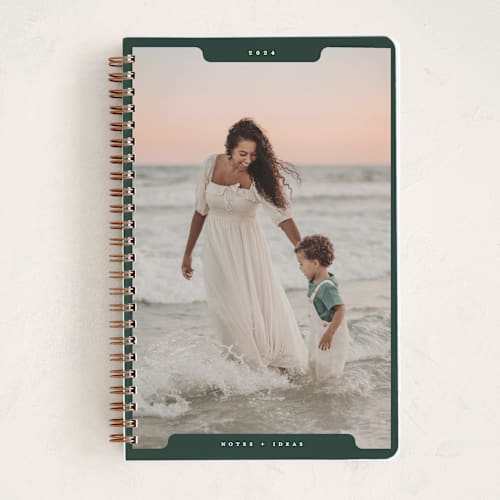 This is a pine journals with standard by Gwen Bedat called holiday file printing on premium cover stock in notebook