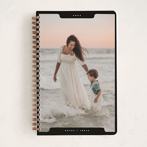 This is a noir journals with standard by Gwen Bedat called holiday file printing on premium cover stock in notebook