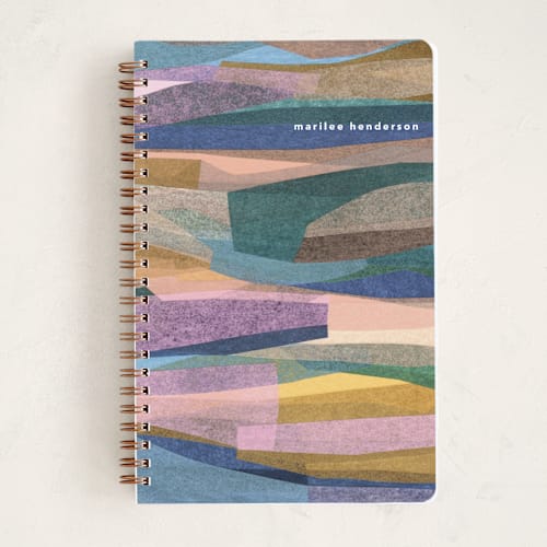 This is a rainbow journals with standard by Carrie Moradi called chromatic forest printing on premium cover stock in notebook