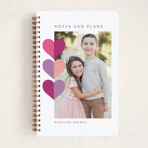This is a raspberry journals with standard by Leah Ragain called hearts trio printing on premium cover stock in notebook