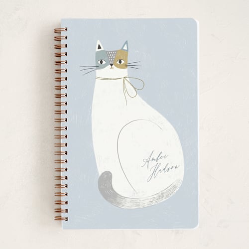 This is a powder blue journals with standard by Monika Torun called feline notes printing on premium cover stock in notebook
