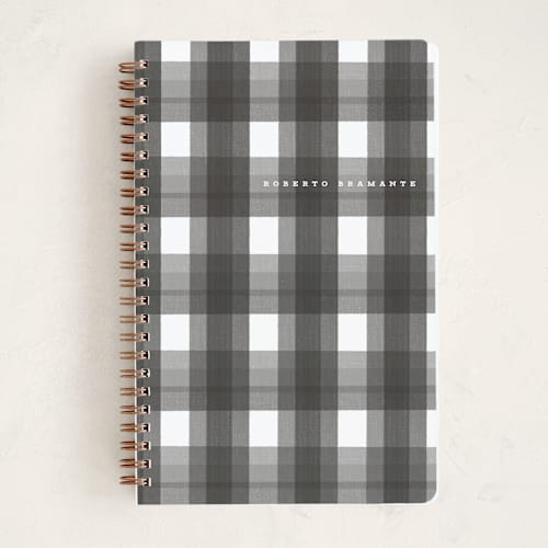 This is a charcoal journals with standard by Corinne Malesic called plaid paper printing on premium cover stock in notebook