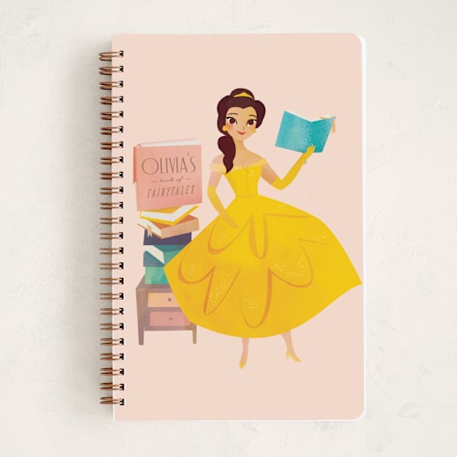 This is a blush journals with standard by Lori Wemple called storytime with belle from disney's beauty and the beast printing on premium cover stock in notebook