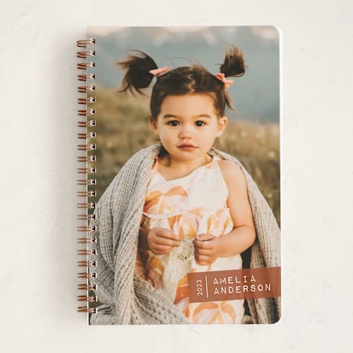 This is a terracotta journals with standard by Jessica Williams called taped up printing on premium cover stock in notebook