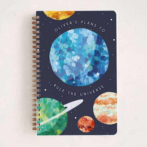 This is a midnight journals with standard by Holly Whitcomb called rule the universe printing on premium cover stock in notebook