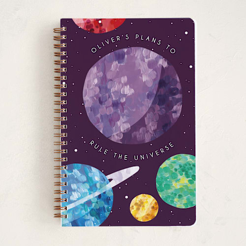 This is a plum journals with standard by Holly Whitcomb called rule the universe printing on premium cover stock in notebook