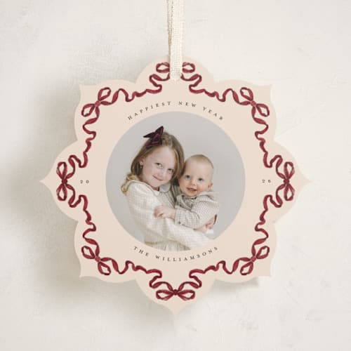 This is a cranberry holiday card ornaments with standard by Jenna Holcomb called bow ornament printing on recycled smooth signature in ornament