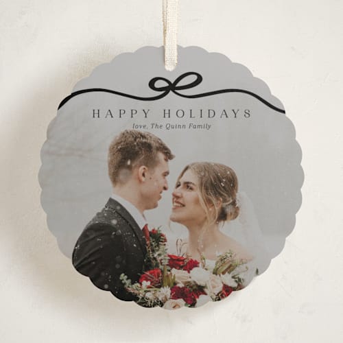This is a coal holiday card ornaments with standard by Kaydi Bishop called bow tied printing on recycled smooth signature in ornament