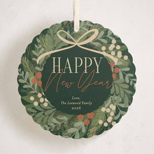 This is a pine needle holiday card ornaments with standard by Erin German called botanical wreath printing on signature in ornament