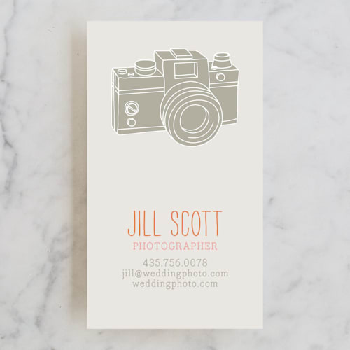 This is a orange business cards by ERAY called camera card printing on signature in standard