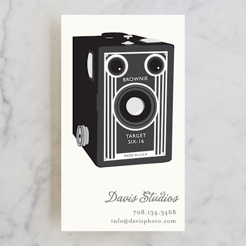 This is a graphite business cards by leslie hamer called brownie printing on signature in standard