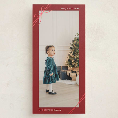 This is a cranberry foil pressed holiday cards with foil pressed by Heather Schertzer called tied with ribbon printing on recycled smooth signature in tall