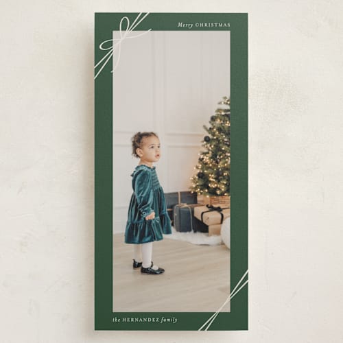 This is a pine holiday photo cards with standard by Heather Schertzer called tied with ribbon printing on recycled smooth signature in tall