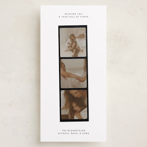 This is a coal holiday photo cards with standard by taylorVdesign called holiday highlight reel printing on recycled smooth signature in tall