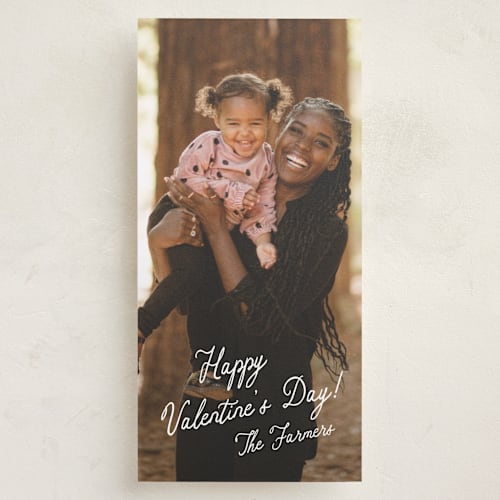 This is a cotton holiday photo cards with standard by Stacey Meacham called enchanting script printing on recycled smooth signature in tall